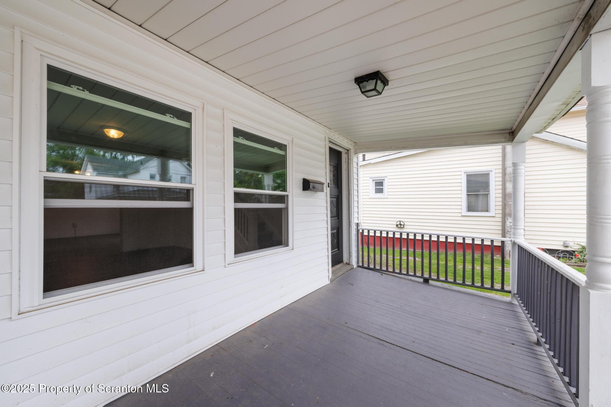 121 Throop Street Scranton, PA 18508 - Photo 12 of 37 a view of livingroom with furniture and floor to ceiling window