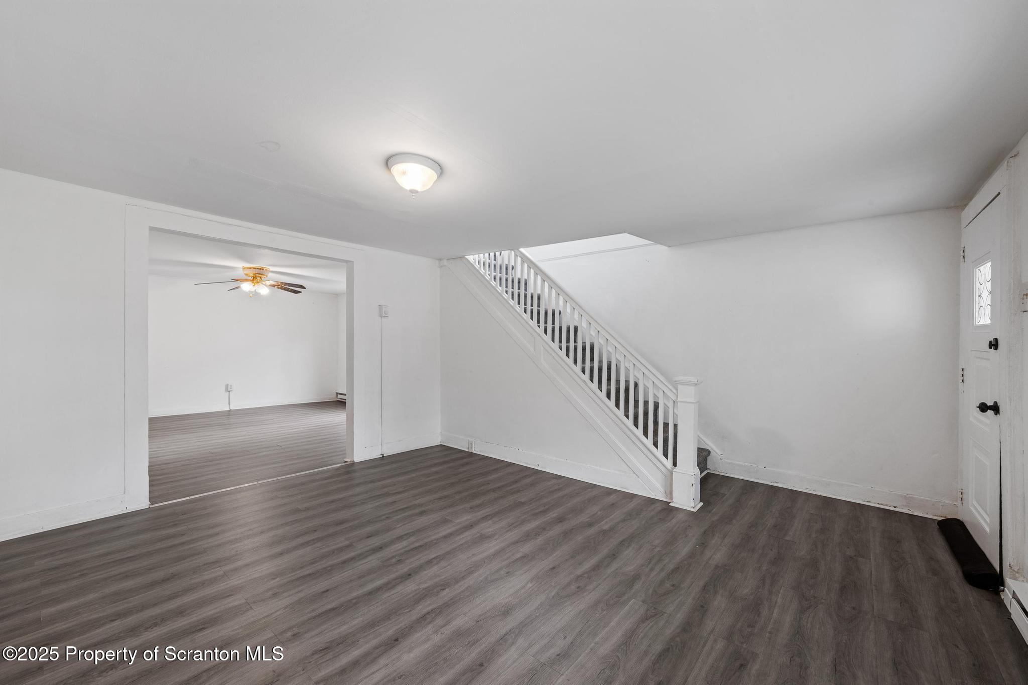 121 Throop Street Scranton, PA 18508 - Photo 15 of 37 a view of an empty room with wooden floor