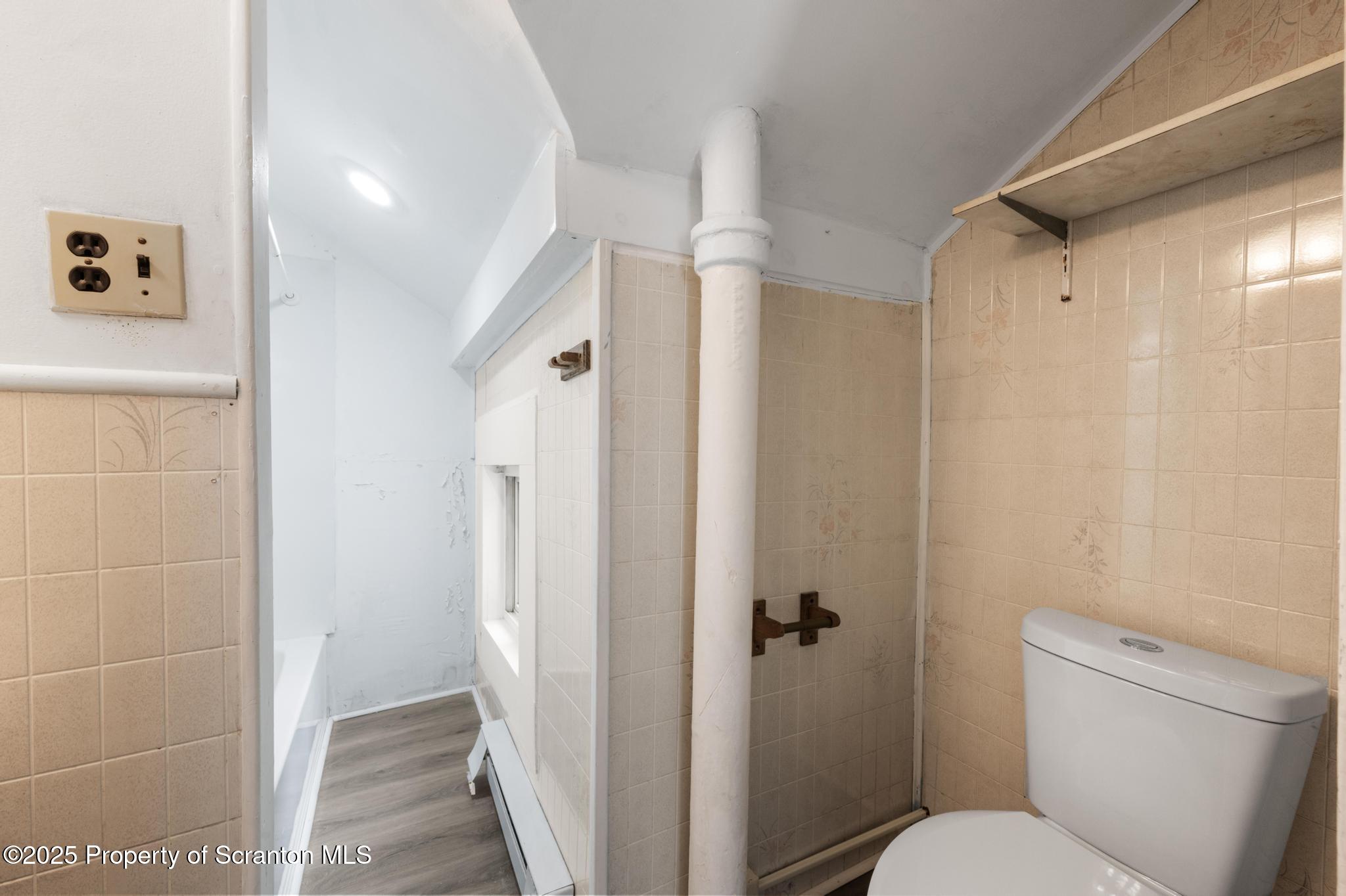 121 Throop Street Scranton, PA 18508 - Photo 29 of 37 a bathroom with a shower and a toilet