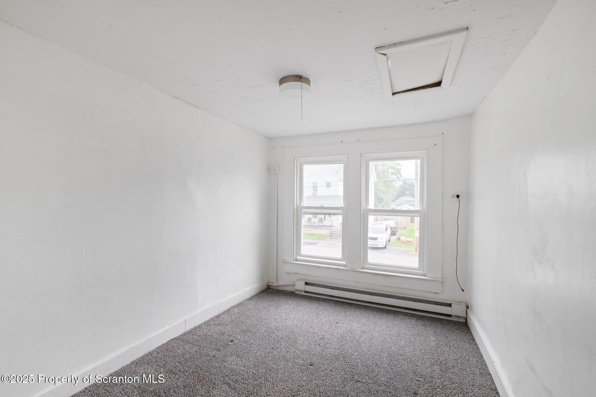 121 Throop Street Scranton, PA 18508 - Photo 30 of 37 an empty room with windows