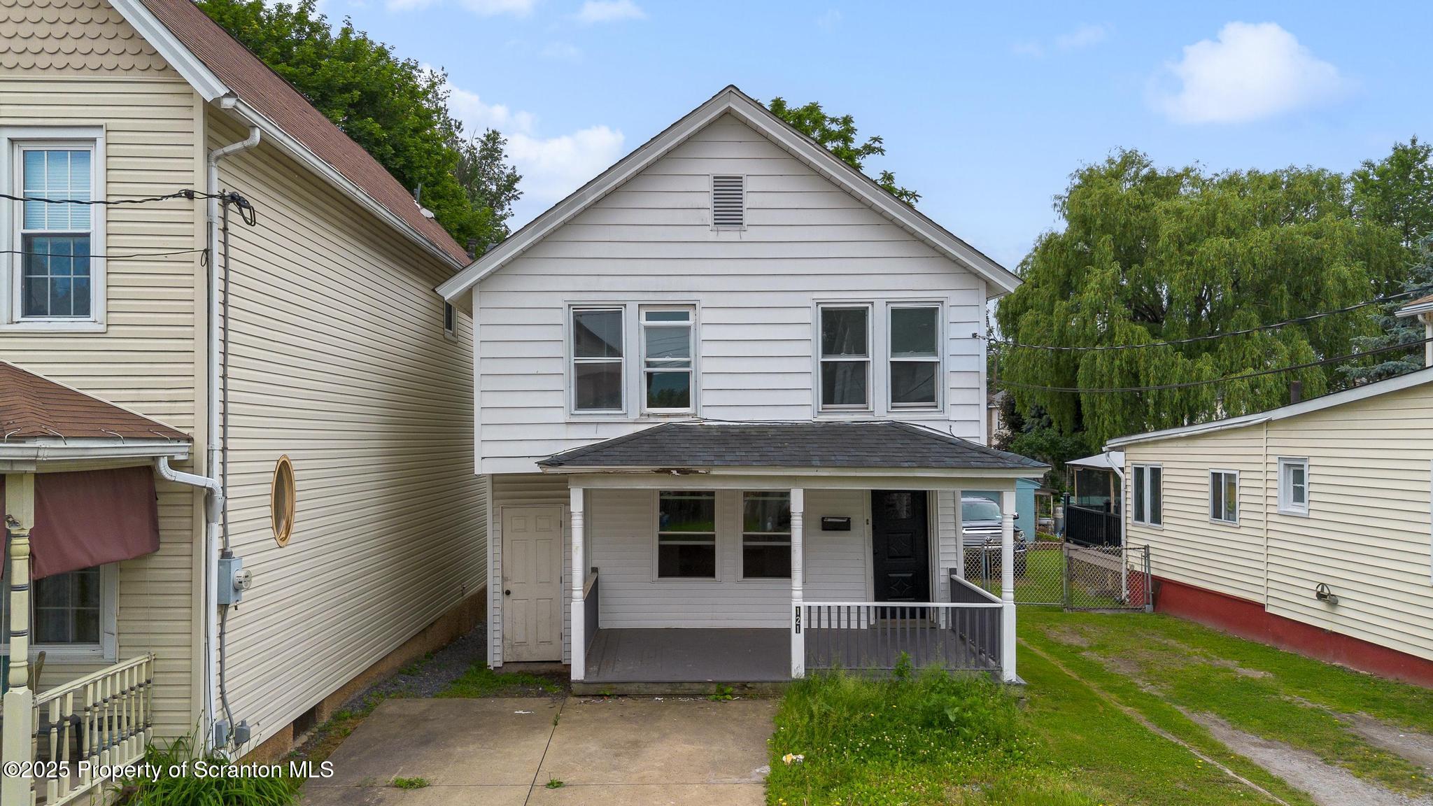 121 Throop Street Scranton, PA 18508 - Photo 3 of 37 a front view of a house with garden