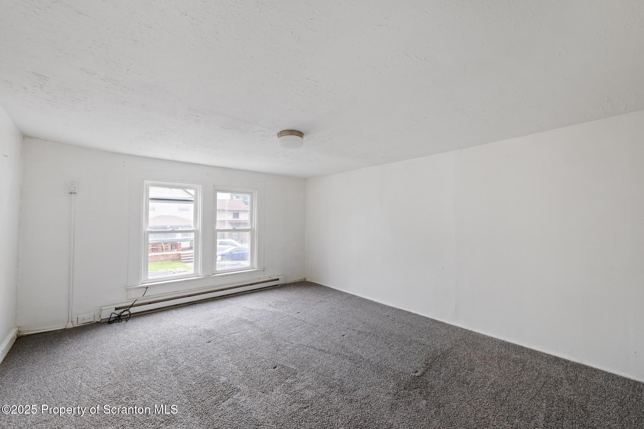 121 Throop Street Scranton, PA 18508 - Photo 32 of 37 an empty room with windows