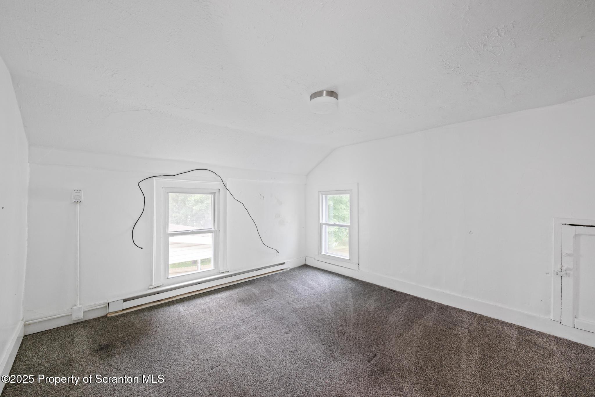 121 Throop Street Scranton, PA 18508 - Photo 34 of 37 an empty room with windows