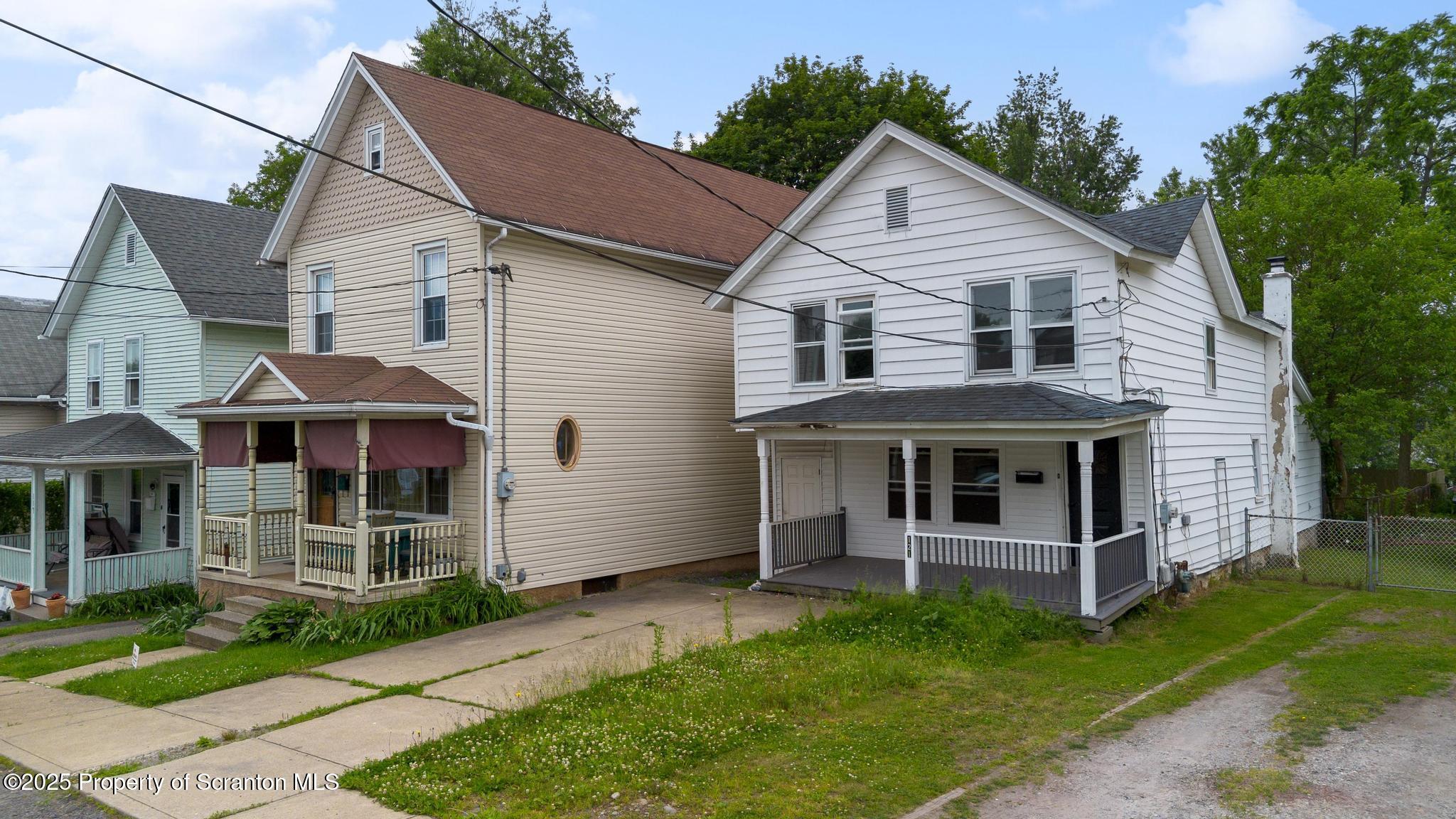 121 Throop Street Scranton, PA 18508 - Photo 4 of 37 a front view of a house with a yard