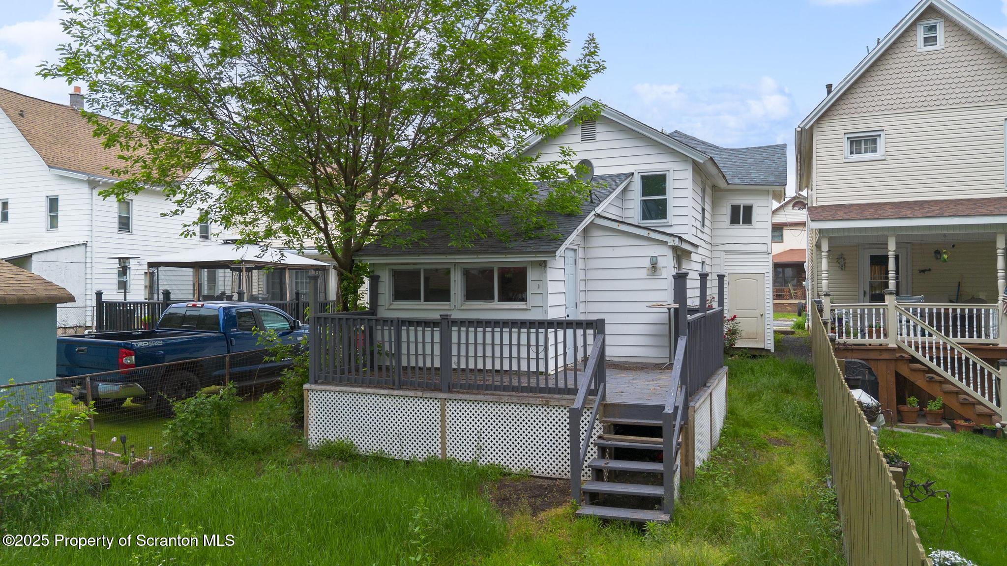 121 Throop Street Scranton, PA 18508 - Photo 10 of 37 a front view of a house with a garden