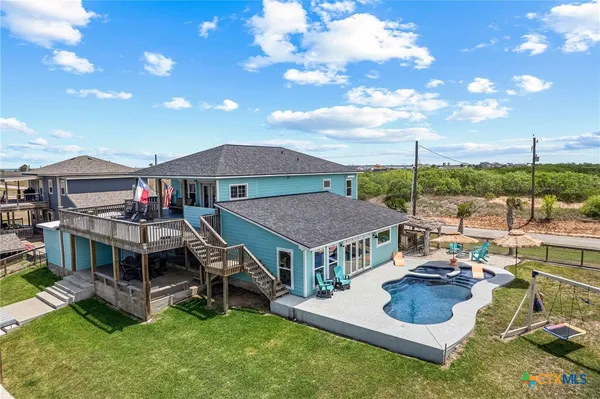 a aerial view of a house with swimming pool