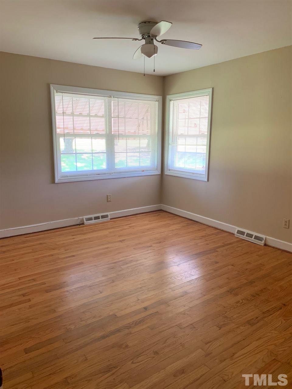 3539 Meadowlark Road Dunn, NC 28334 - Photo 11 of 25 a view of an empty room with wooden floor and a window