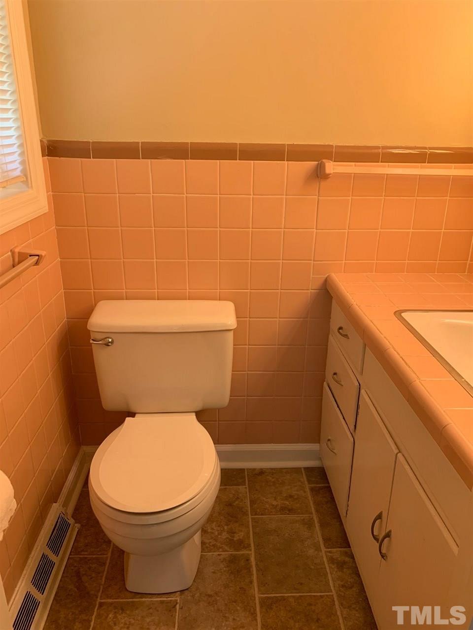 3539 Meadowlark Road Dunn, NC 28334 - Photo 12 of 25 a bathroom with a toilet and a shower