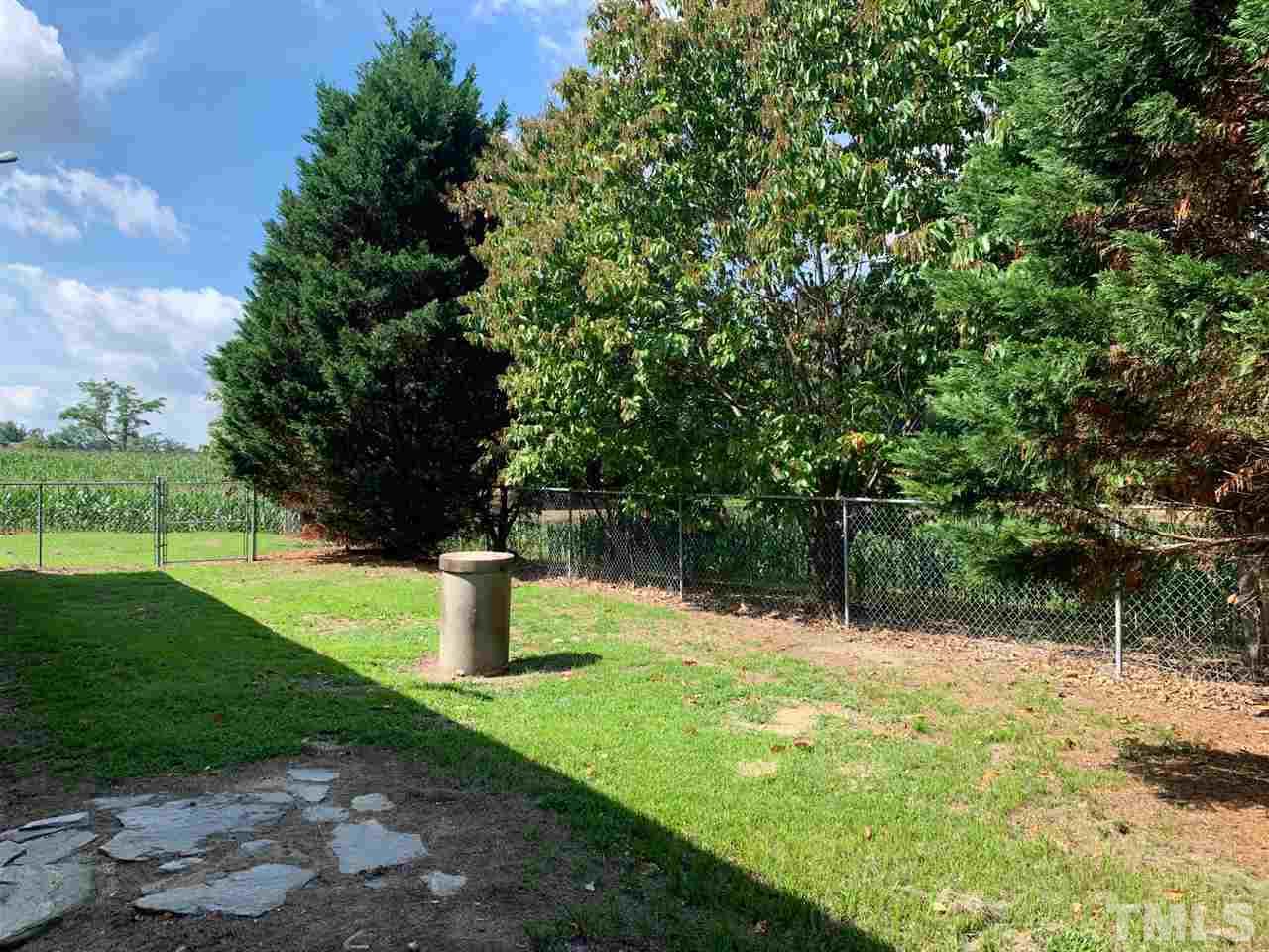 3539 Meadowlark Road Dunn, NC 28334 - Photo 13 of 25 a fire hydrant in the middle of a field