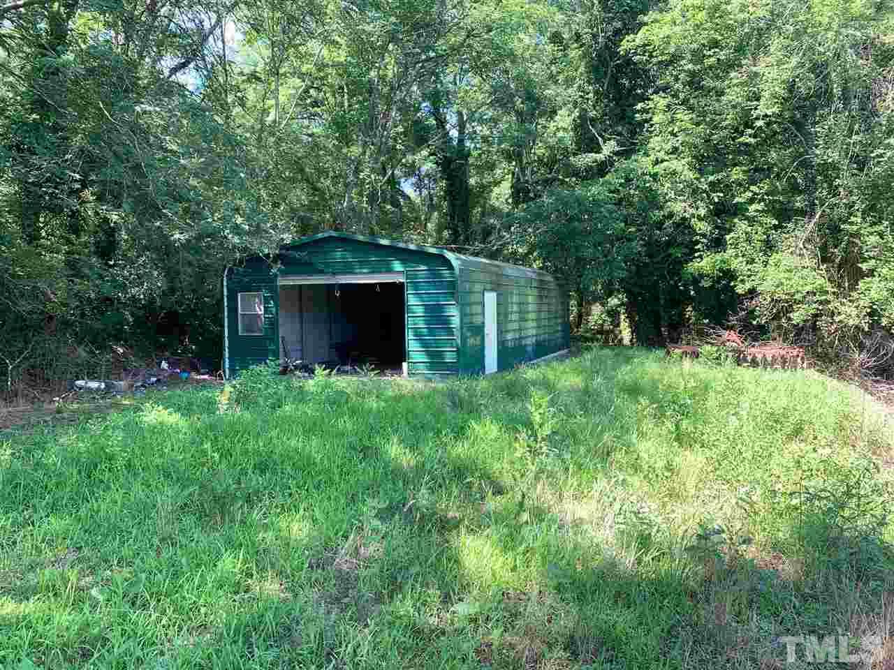 3539 Meadowlark Road Dunn, NC 28334 - Photo 17 of 25 a backyard of a house with lots of green space