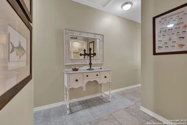 a room with window and wall paintings