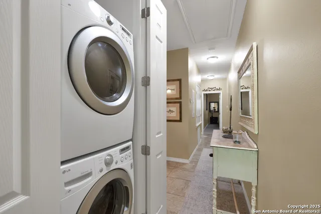 a view of a hallway with washer and dryer
