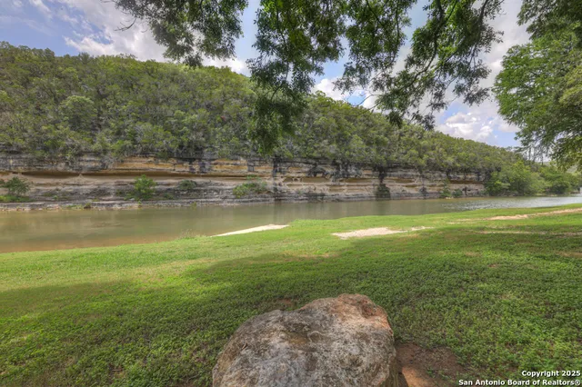 a view of a lake with a yard