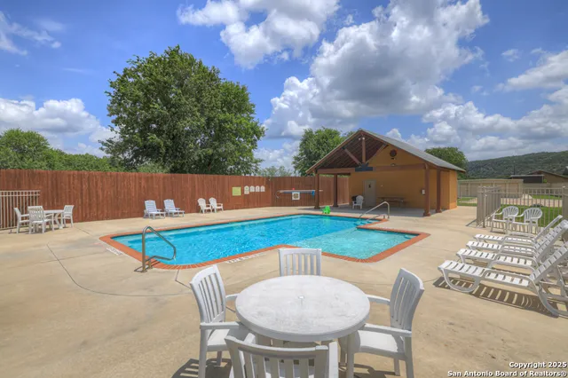 a view of a chairs and table on the terrace