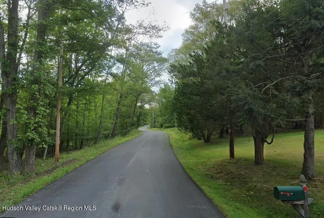 a view of a street with a trees