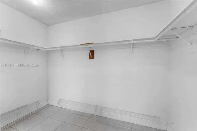 a view of backyard with wooden fence