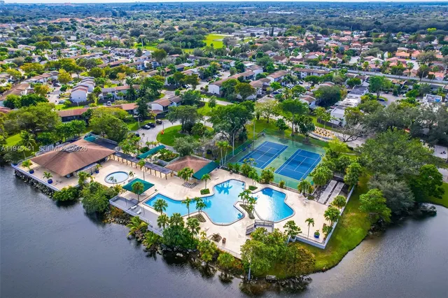 a view of swimming pool with a table and chairs