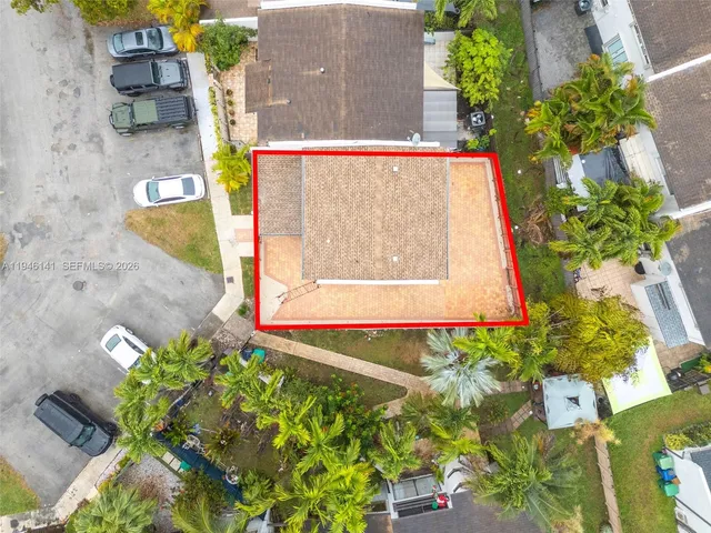 an aerial view of residential houses with outdoor space