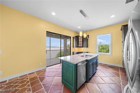 a kitchen with a stove and a refrigerator