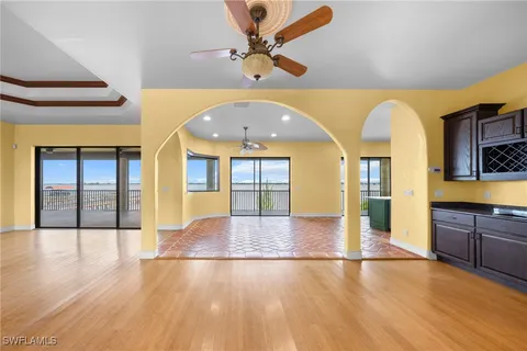 a view of an entryway with wooden floors