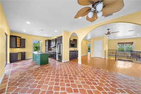 a view of a living room and a livingroom with furniture chandelier