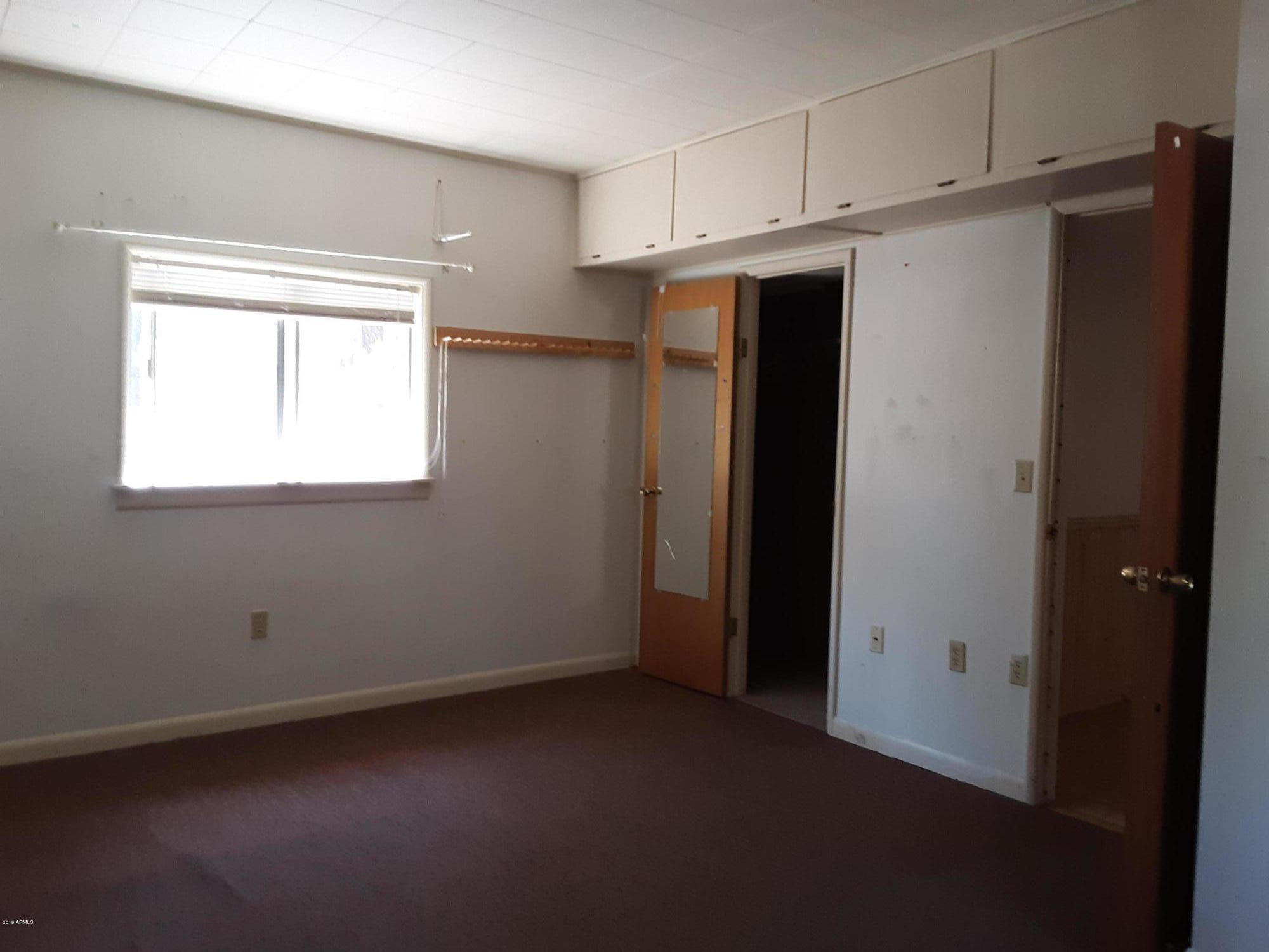 6137 B Street Lakeside, AZ 85929 - Photo 13 of 16 a view of a storage & utility room with closet window