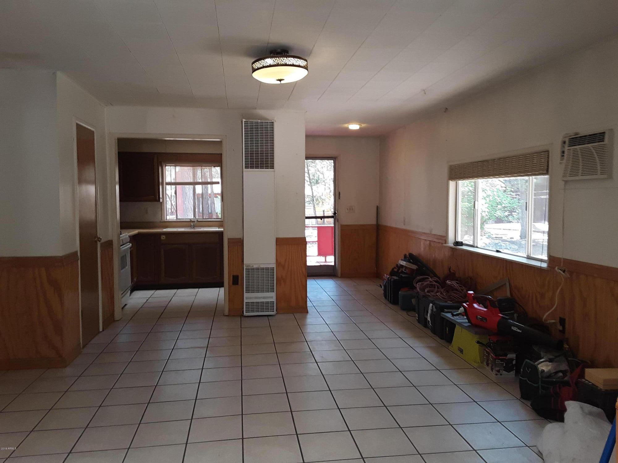 6137 B Street Lakeside, AZ 85929 - Photo 5 of 16 a living room with furniture and a flat screen tv