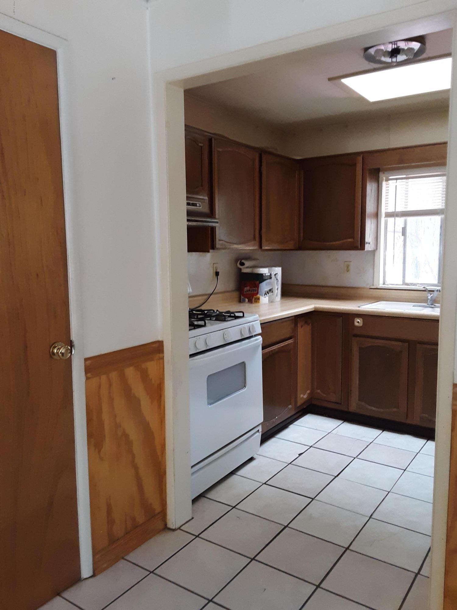 6137 B Street Lakeside, AZ 85929 - Photo 7 of 16 a kitchen with a cabinets and appliances
