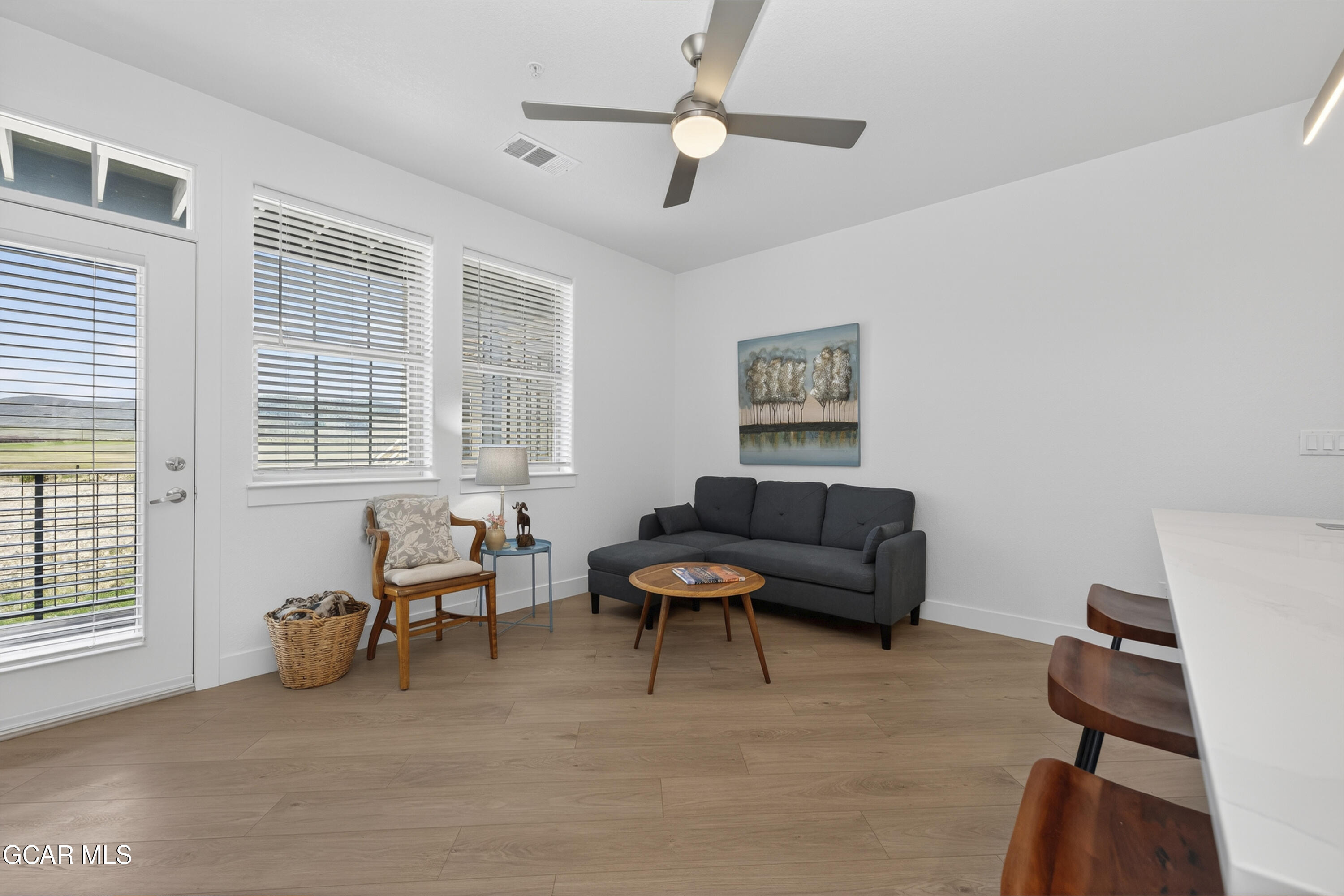 160 Village Road, Unit F207 Granby, CO 80446 - Photo 7 of 28 a living room with furniture and a window