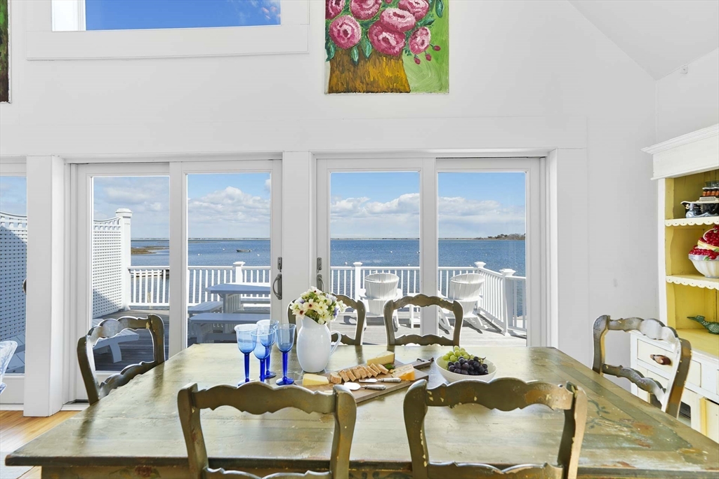 31 The Boulevard Edgartown, MA 02539 - Photo 11 of 39 a dining room with furniture and wooden floor