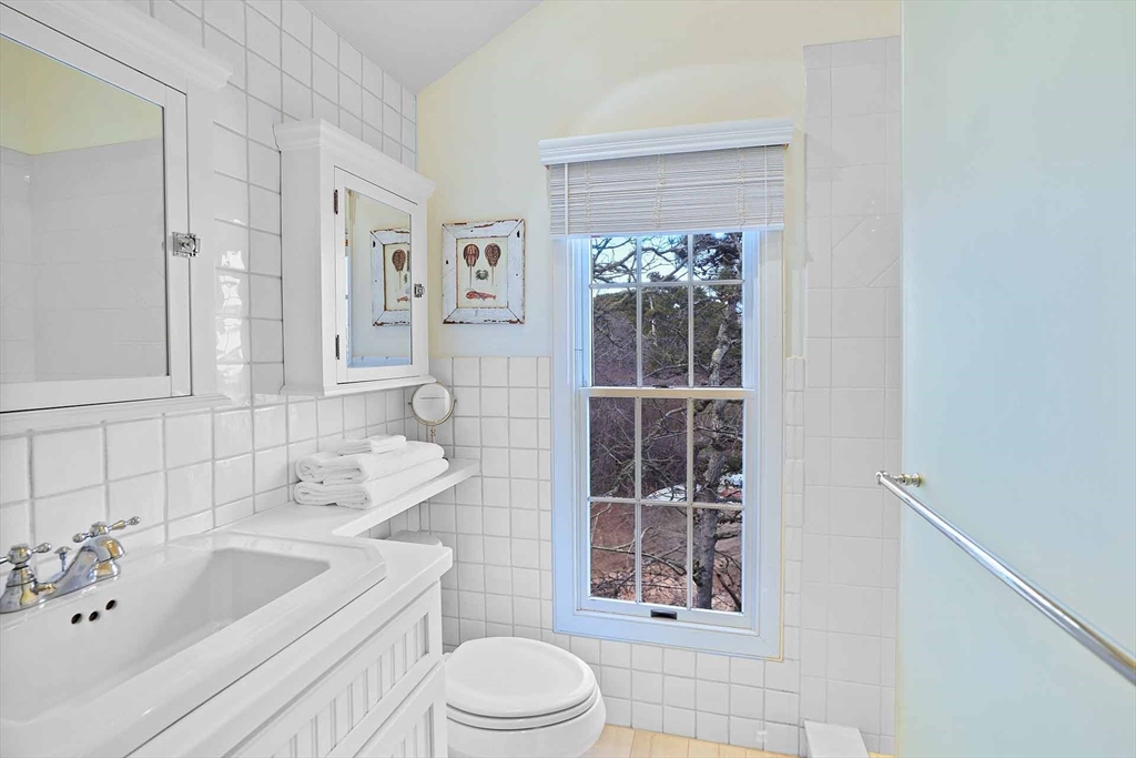 31 The Boulevard Edgartown, MA 02539 - Photo 29 of 39 a bathroom with a sink a toilet and shower