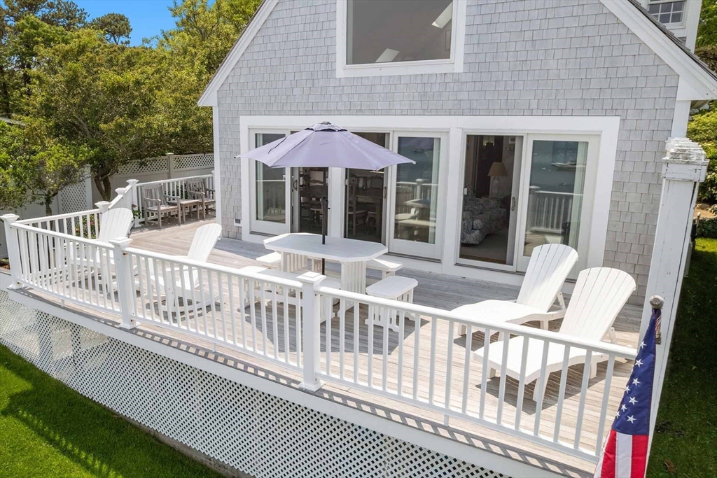 31 The Boulevard Edgartown, MA 02539 - Photo 31 of 39 a view of a house with a wooden deck