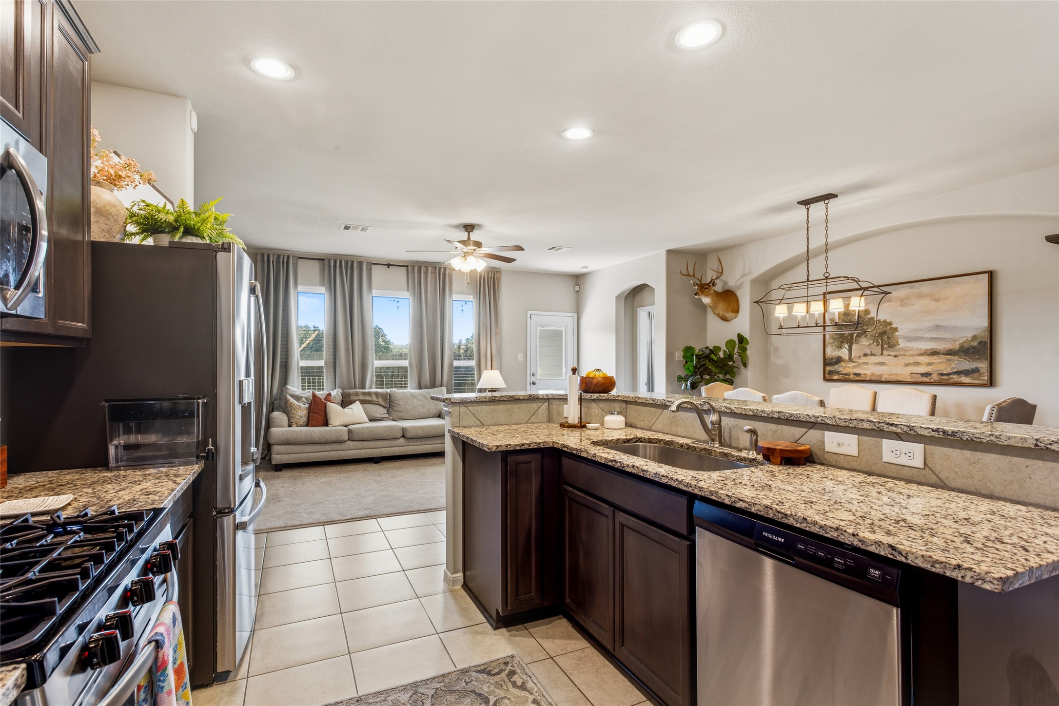 7254 Victorville Drive Rosharon, TX 77583 - Photo 6 of 27 a kitchen with a sink and stove