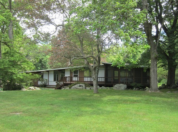 94 Conant Road Lincoln, MA 01773 - Photo 4 of 14 a front view of house with a garden and trees