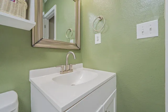 a bedroom with a bed and a table