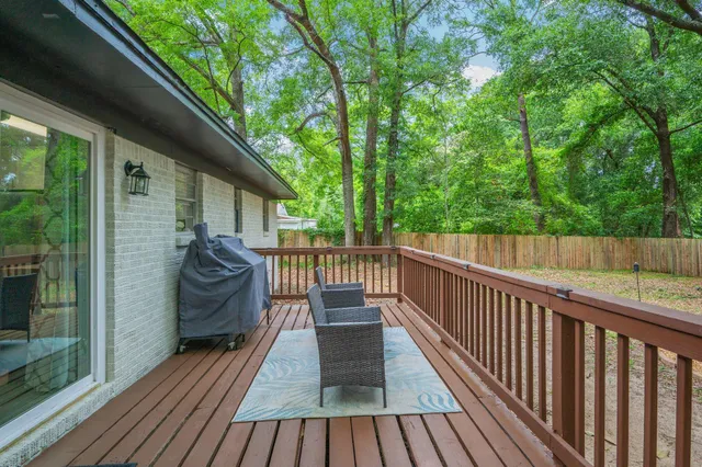 a view of a two chairs in the balcony