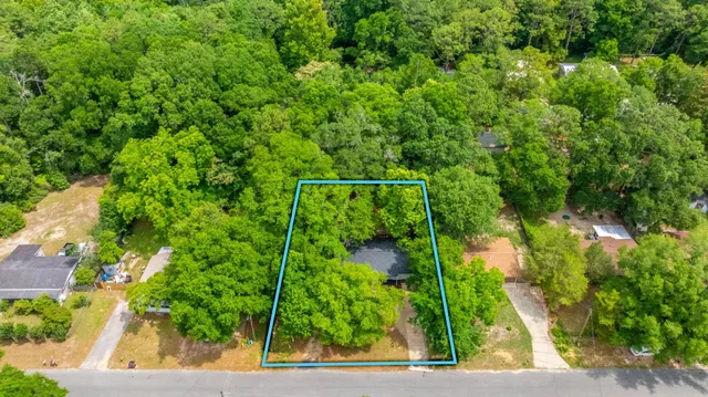 a view of a swimming pool with a yard