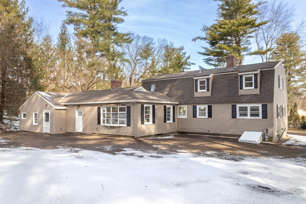123 Lowell Road Pepperell, MA 01463 - Photo 23 of 30 a front view of a house with a garden