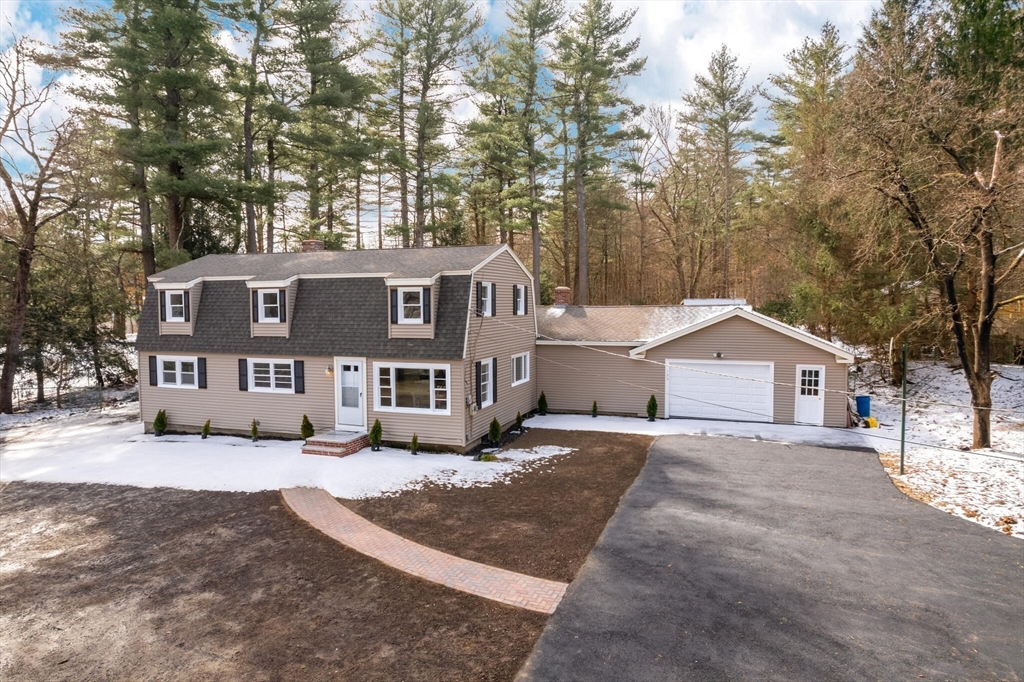 123 Lowell Road Pepperell, MA 01463 - Photo 24 of 30 a front view of a house with a yard and large trees