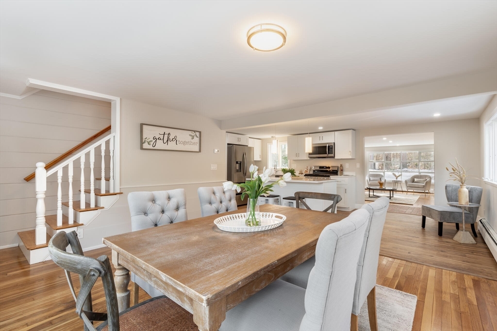 123 Lowell Road Pepperell, MA 01463 - Photo 3 of 30 a view of a dining room with furniture and wooden floor