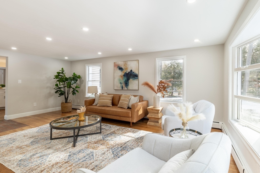 123 Lowell Road Pepperell, MA 01463 - Photo 7 of 30 a living room with furniture and a potted plant