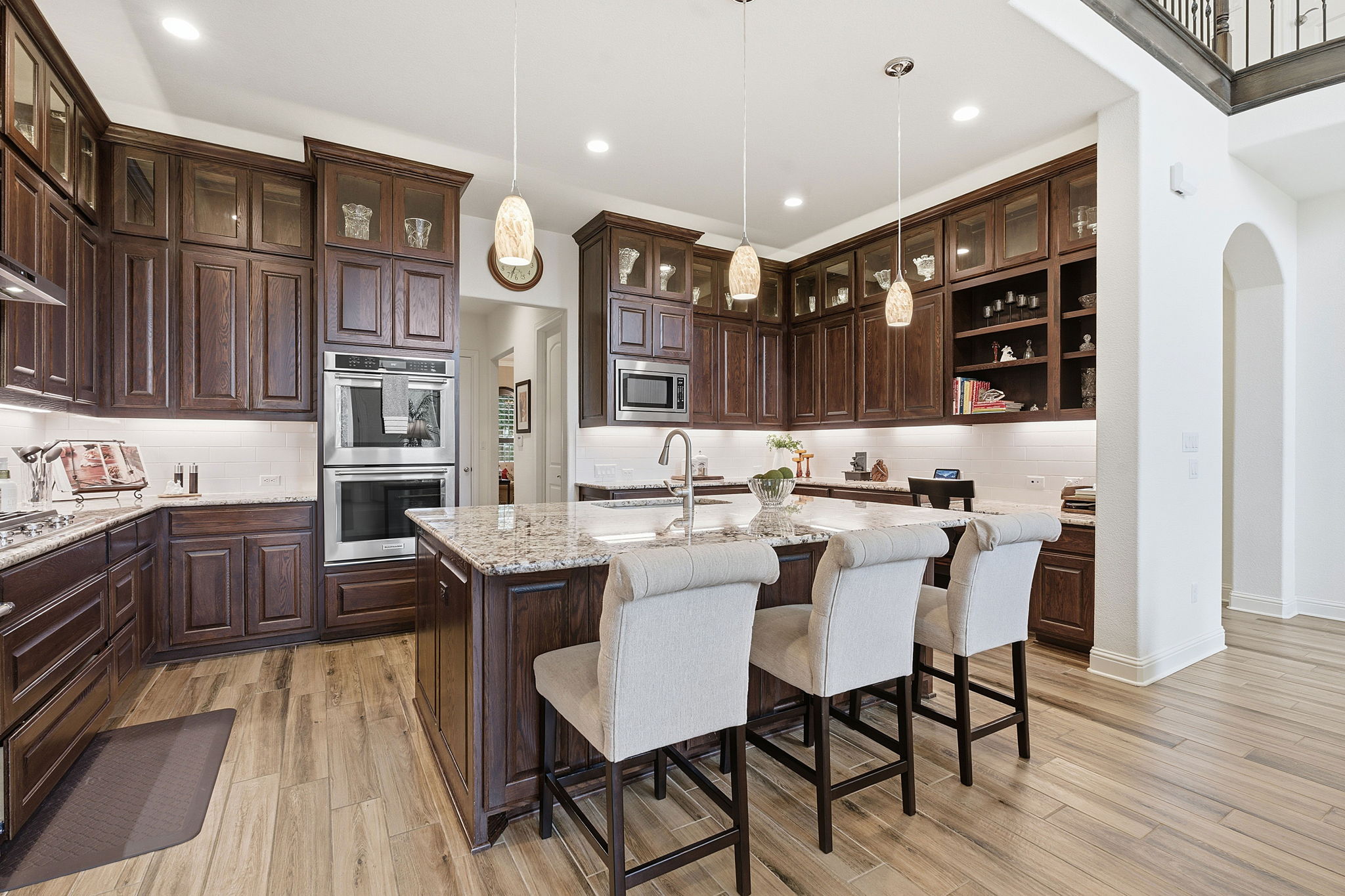 2824 Wedgescale Pass Leander, TX 78641 - Photo 12 of 40 Extra seating at the eat-in center island in this kitchen