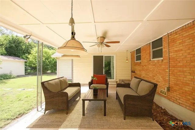 a outdoor living space with furniture and garden view