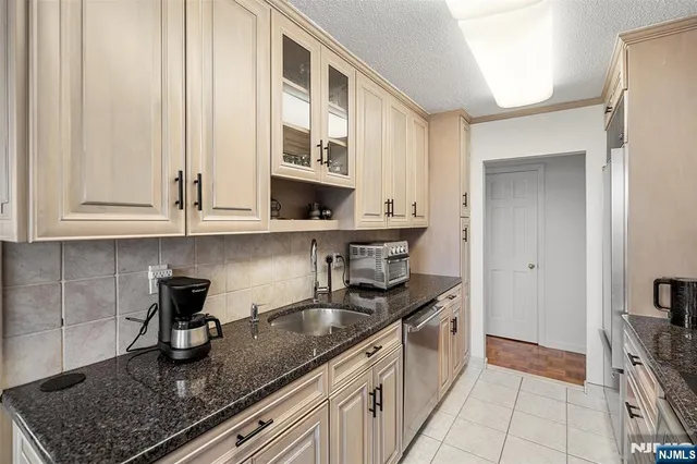 a living room with furniture a flat screen tv and a window