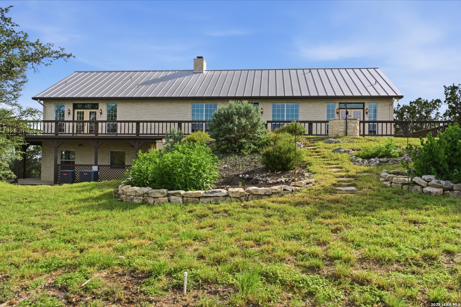 26 Seewald Road Boerne, TX 78006 - Photo 17 of 33 a view of a house with a yard and sitting area