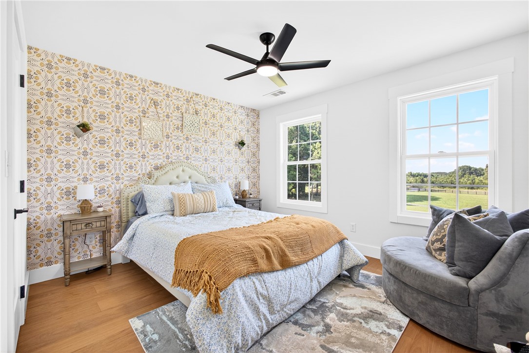 5016 Copeland Road Belton, SC 29627 - Photo 27 of 45 Hardwood floors and bright windows create a cheerful and inviting ambiance in this bedroom oasis.