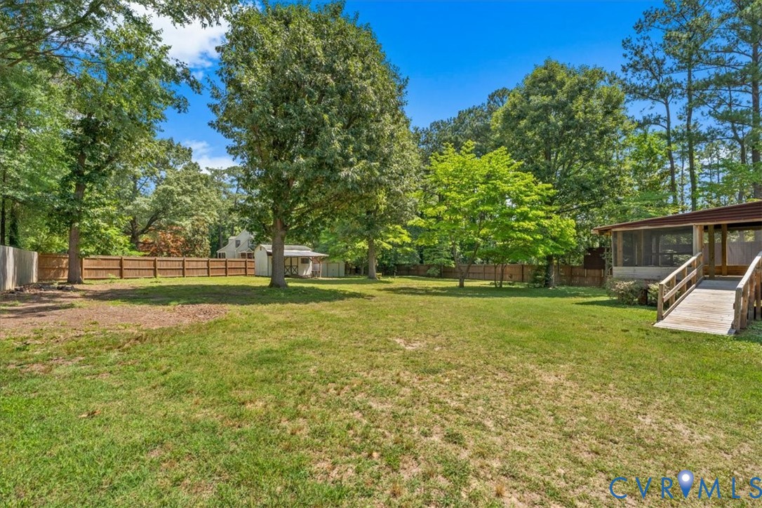 2924 Warfield Ridge Terrace Chester, VA 23831 - Photo 3 of 38 Expansive backyard featuring a large grassy area,