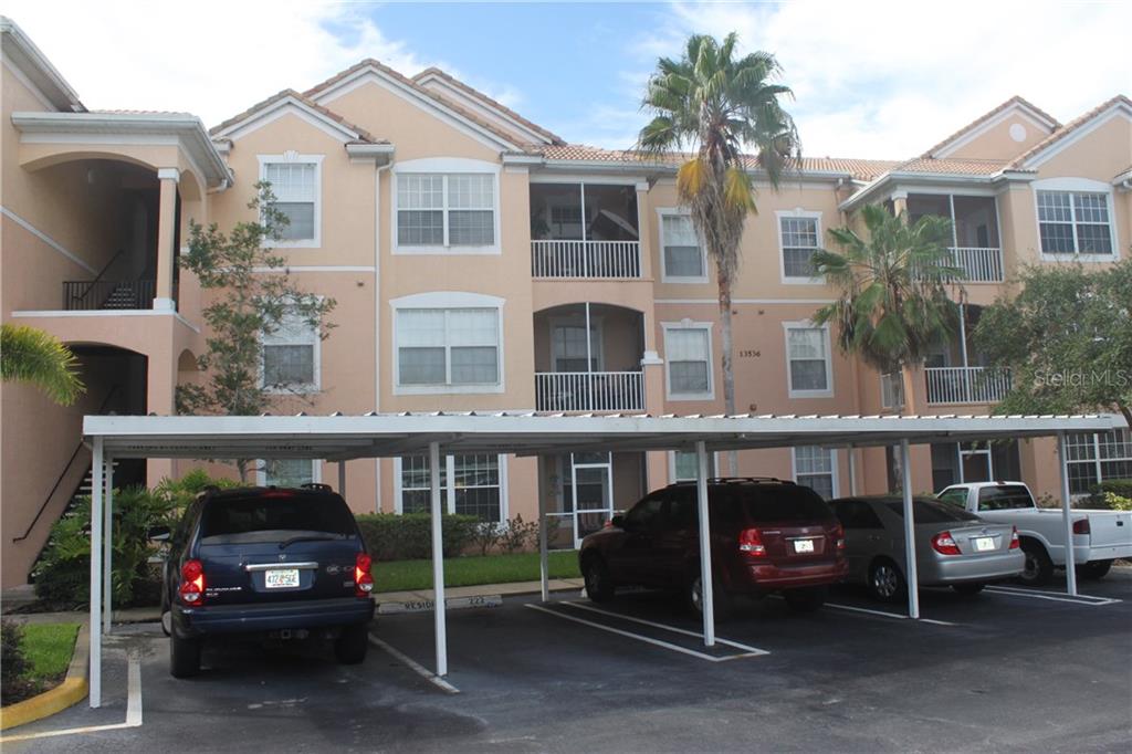 13536 Turtle Marsh Loop, Unit 534 Orlando, FL 32837 - Photo 1 of 1 a view of a car park in front of house