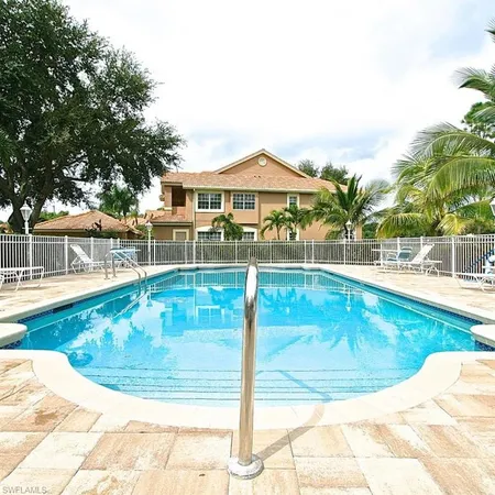 a view of a swimming pool with a patio