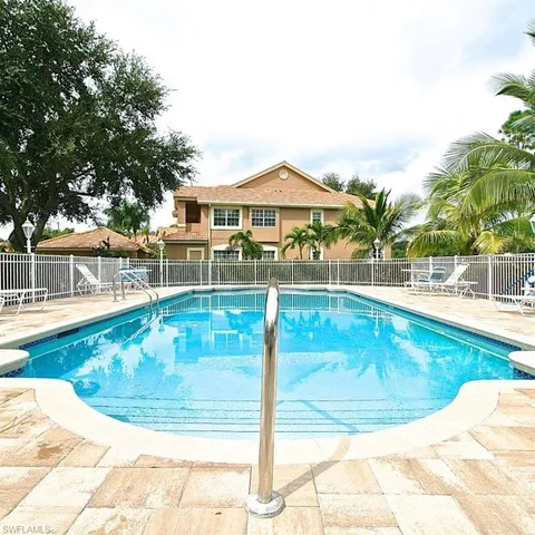 a view of a swimming pool with a patio